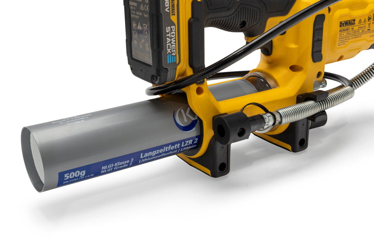 Closeup of DeWalt cordless grease gun with lithium ion battery and grease cartridge for lubrication.