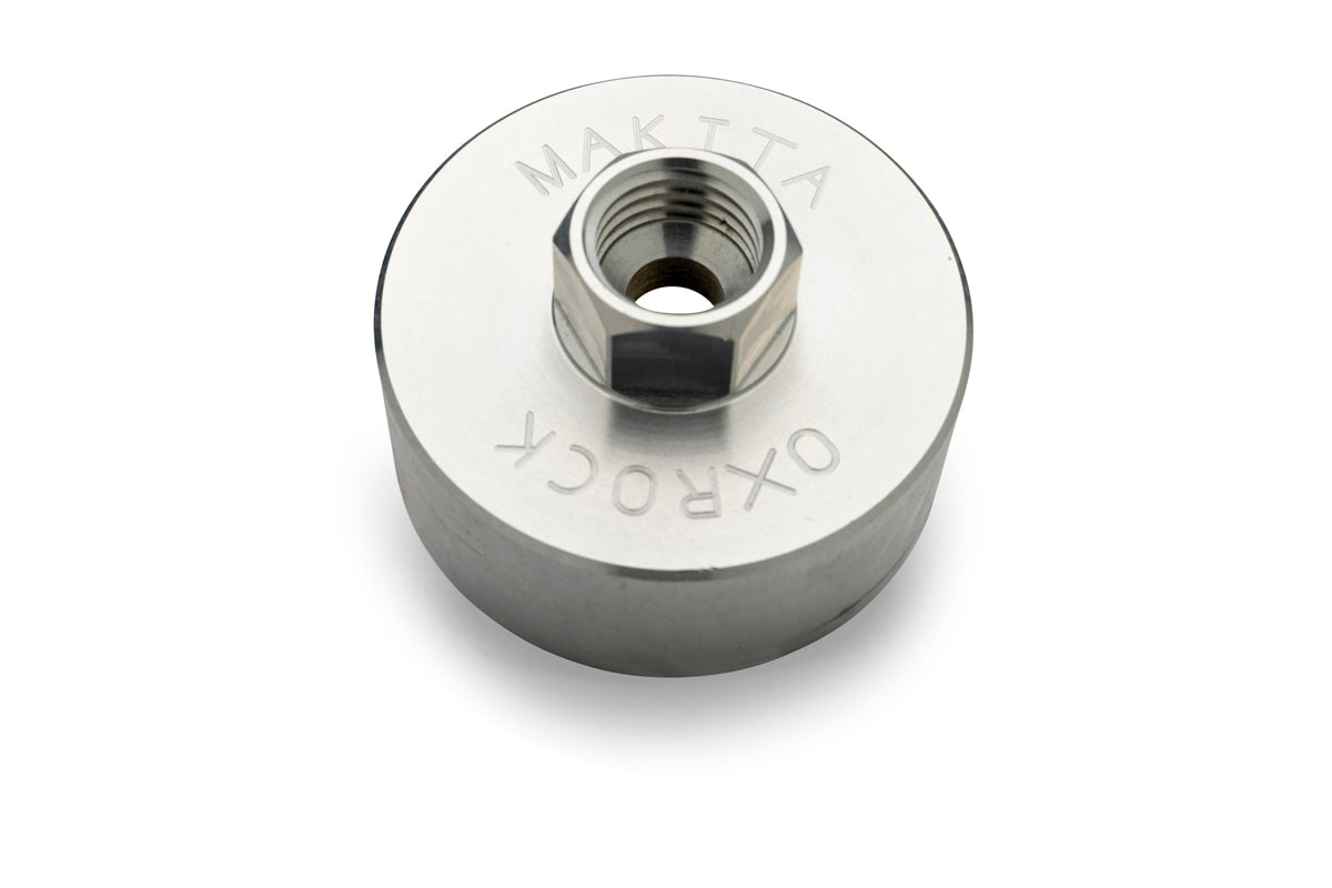 Stainless steel Makita OxRock adapter for converting grease guns to use modern screw thread cartridges.