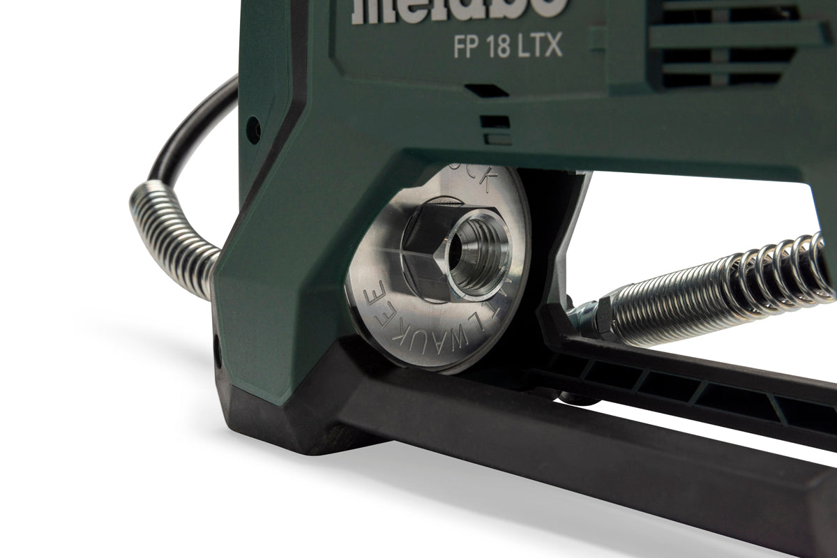 Close-up of Metabo FP 18 LTX grease gun nozzle and Milwaukee grease cartridge with flexible hose on a white background.