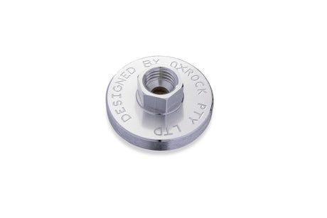 Silver metal grease gun adapter cap with threaded center and OxRock branding for secure cartridge fitting.